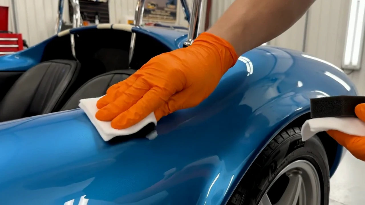 Coating applied by hand to a vehicle finish