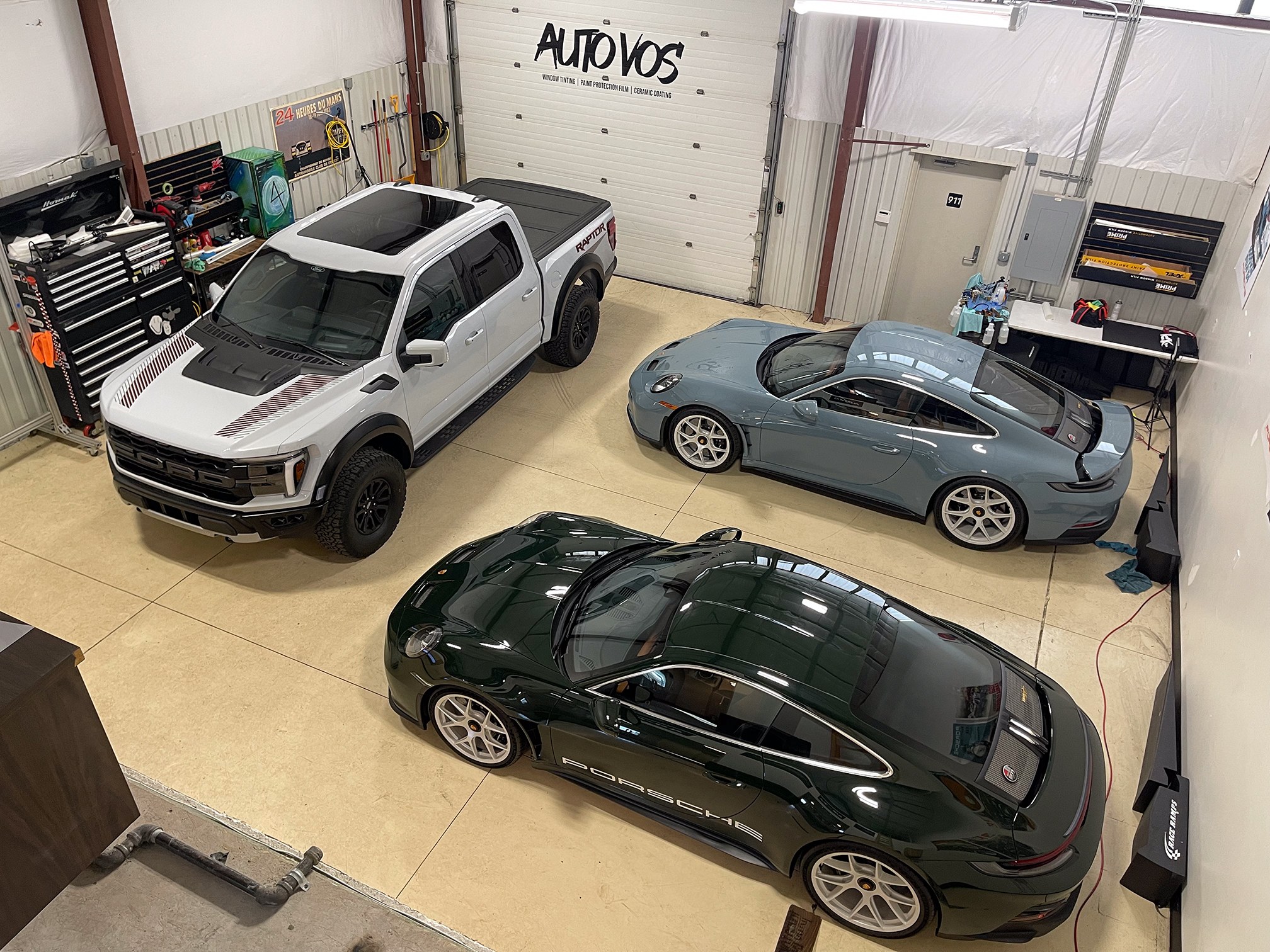Vehicles in the Auto Vos work bays, seen from above
