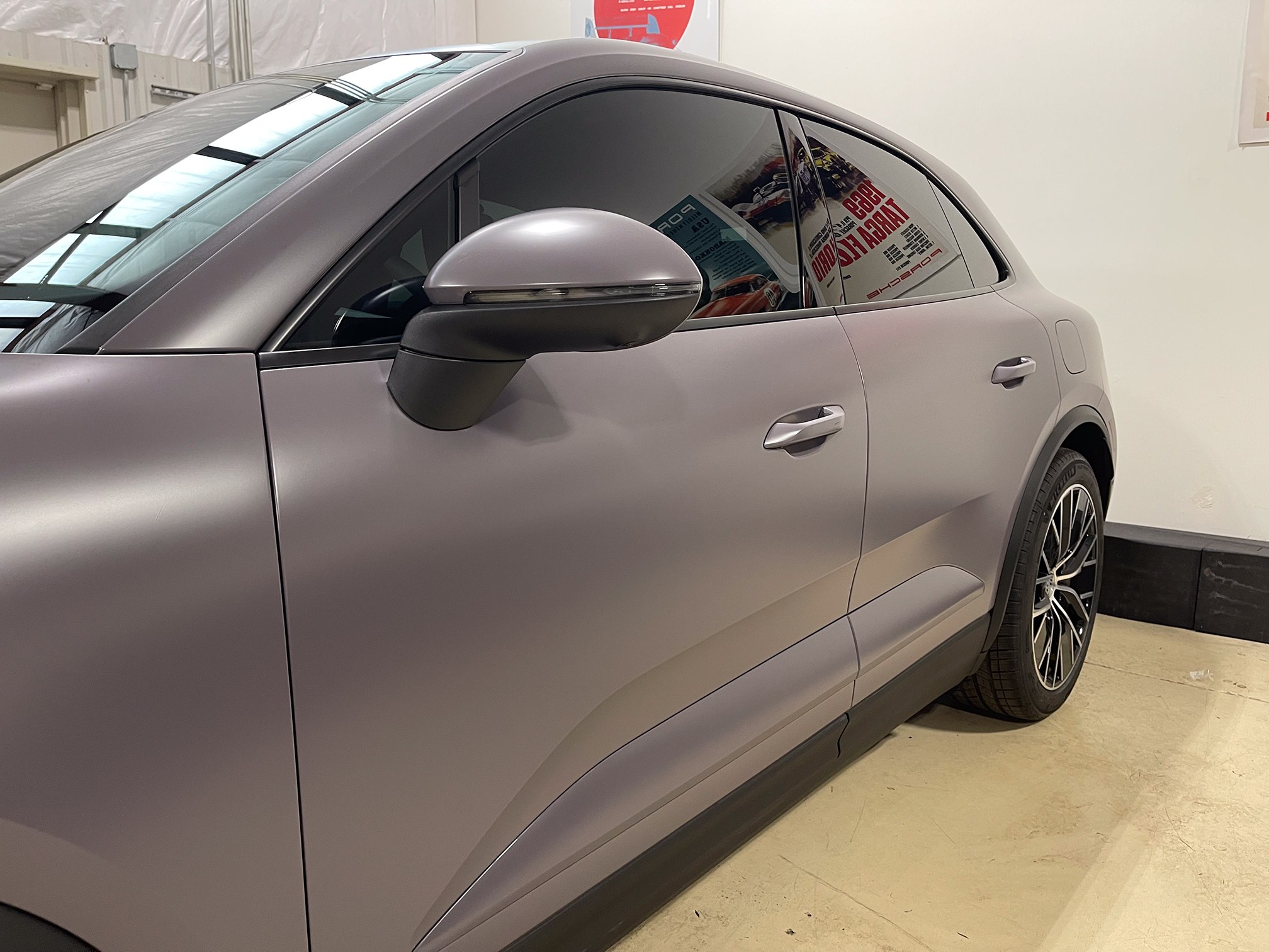 Satin lavender-gray Porsche Macan door and mirror in close-up Satin lavender-gray Porsche Macan door and mirror in close-up