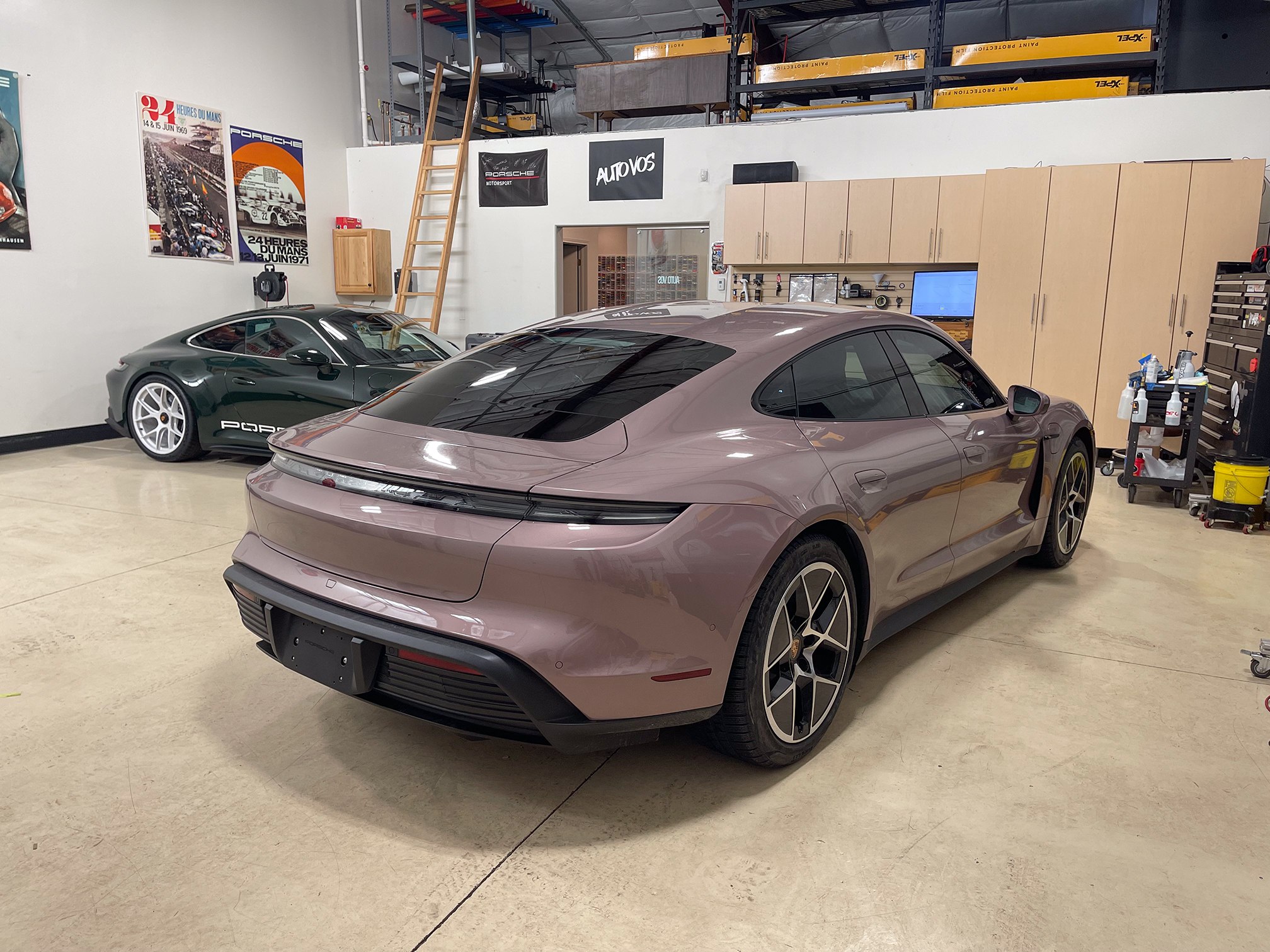 Rose-colored Porsche Taycan rear quarter and window glass inside Auto Vos Rose-colored Porsche Taycan rear quarter and window glass inside Auto Vos
