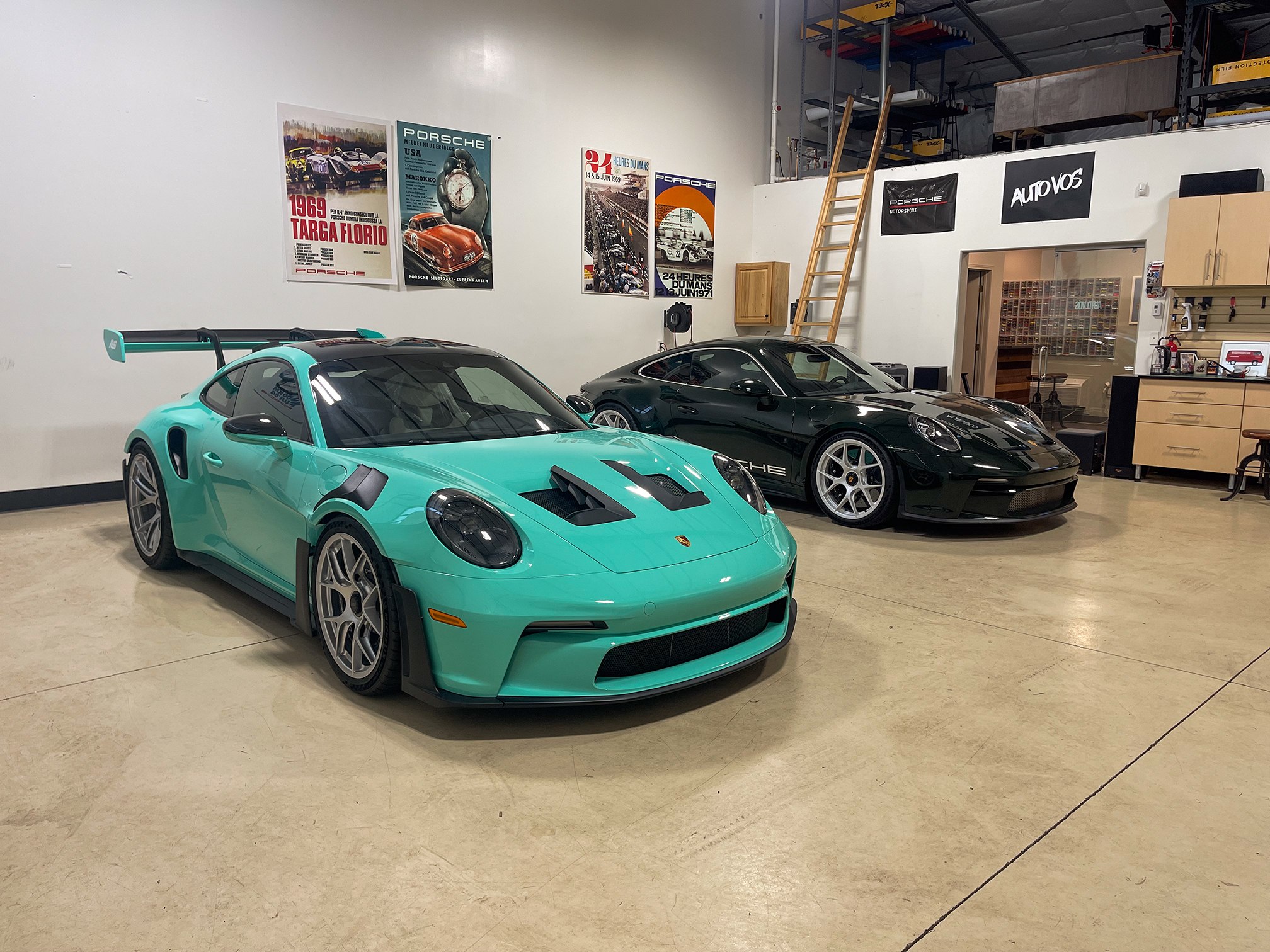 Turquoise Porsche 911 with a large rear wing in the workshop Turquoise Porsche 911 with a large rear wing in the workshop